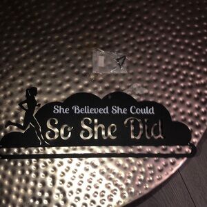Metal holder she believed she could so she did